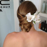Wedding hair style up do with flower accessory by Les Ciseaux St. Armands